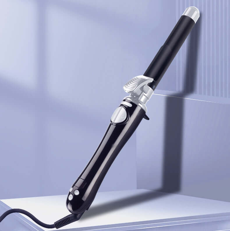 Close-up of an automatic curling iron with ceramic plates and a rotating barrel